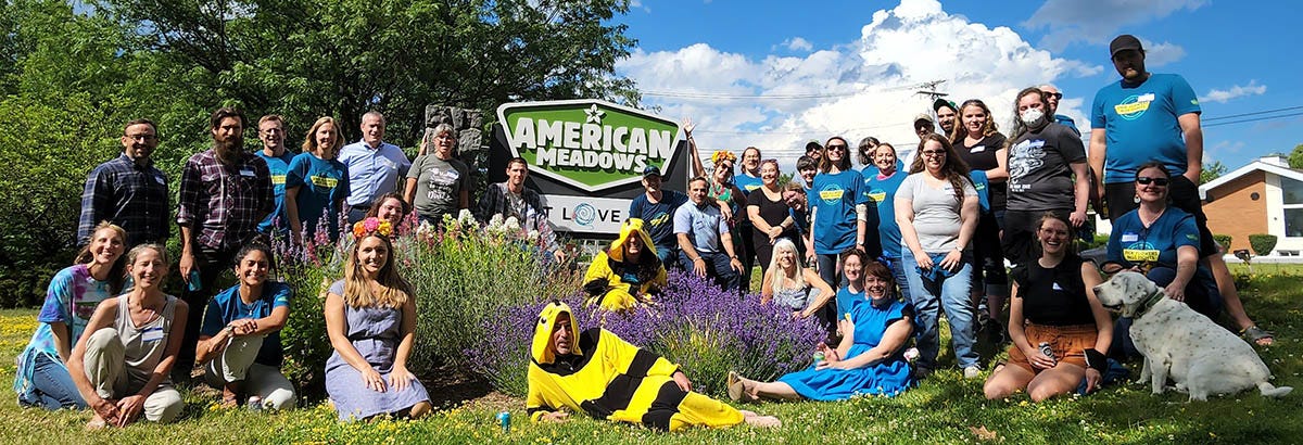 American Meadows Employees in front of American Meadows Sign