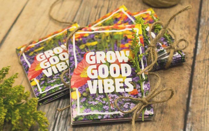 Floral Seed Packet Favors With "Grow Good Vibes" slogan for event